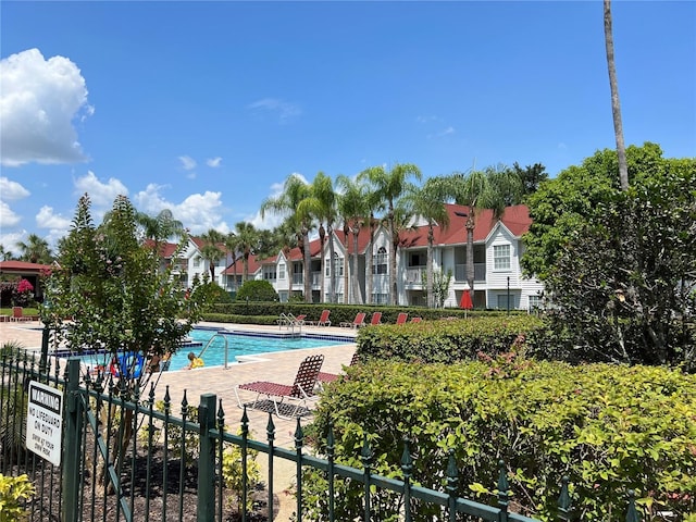 11538 Westwood Blvd Unit 226, Orlando, FL 32821 - community pool featuring a patio and a residential view