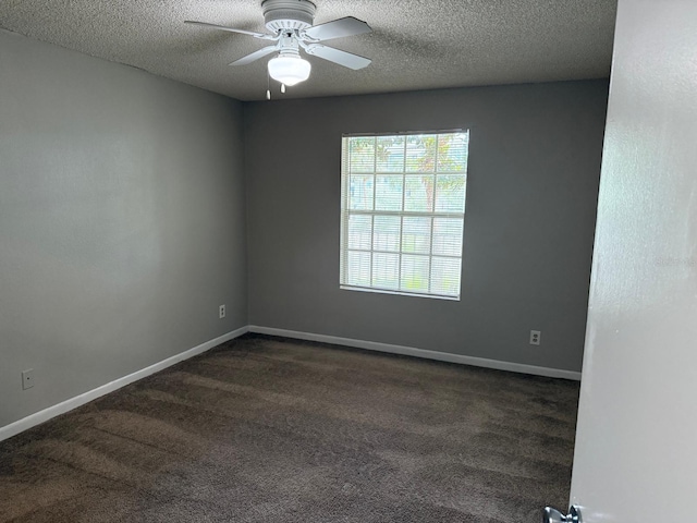 11538 Westwood Blvd Unit 226, Orlando, FL 32821 - empty room featuring a textured ceiling, dark colored carpet, and a ceiling fan