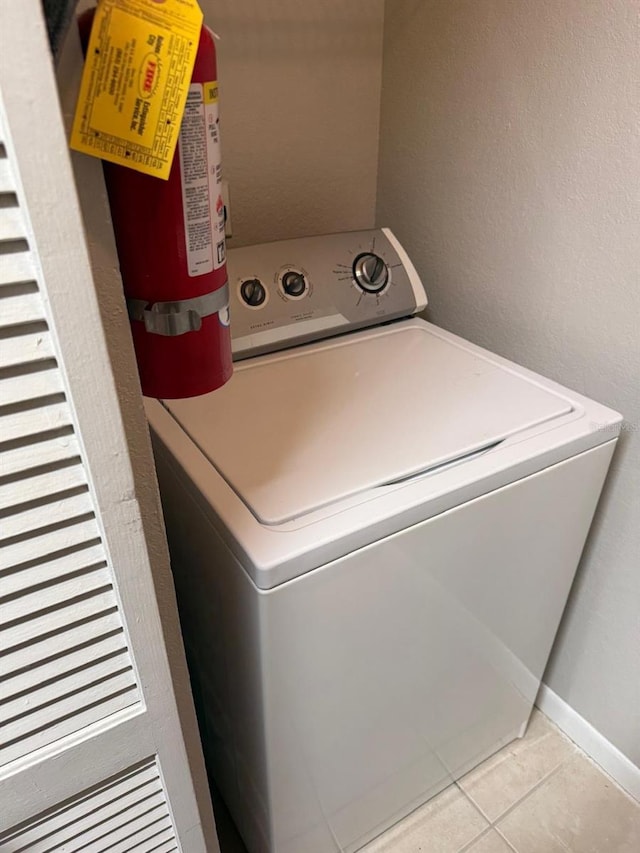 11538 Westwood Blvd Unit 226, Orlando, FL 32821 - laundry area with washer / clothes dryer and tile patterned floors
