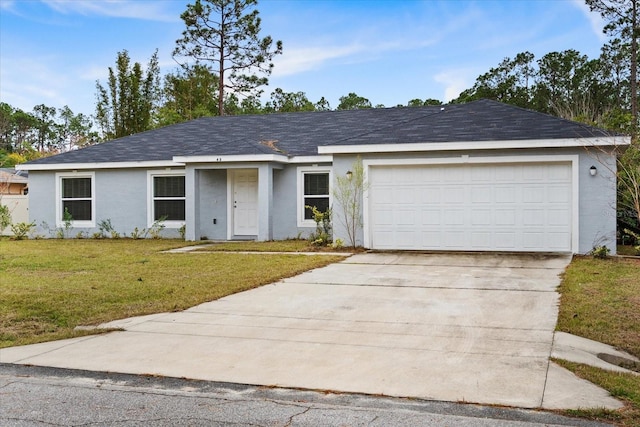 single story home featuring a garage and a front lawn