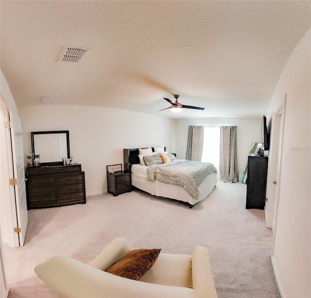 bedroom featuring ceiling fan and carpet