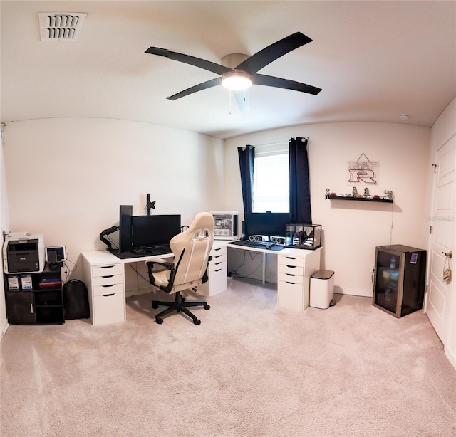 home office featuring ceiling fan and light carpet