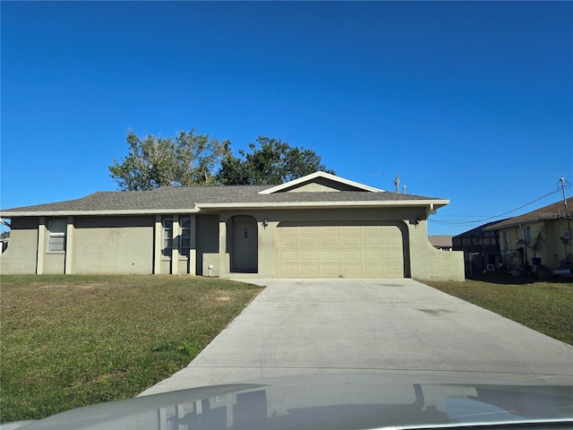 view of front facade with a front yard and a garage