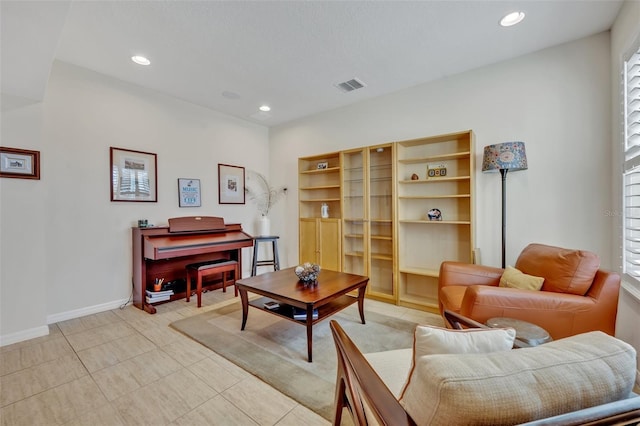 sitting room featuring light tile patterned flooring