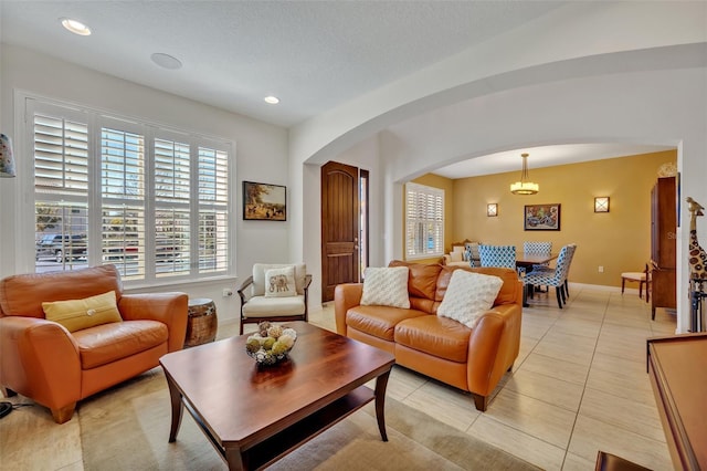 tiled living room with a textured ceiling