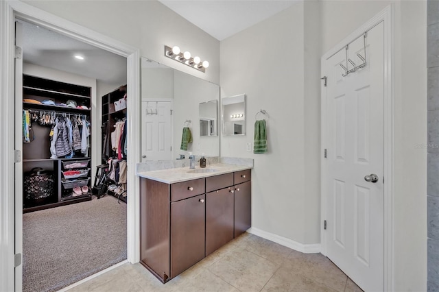 bathroom featuring tile patterned floors and vanity