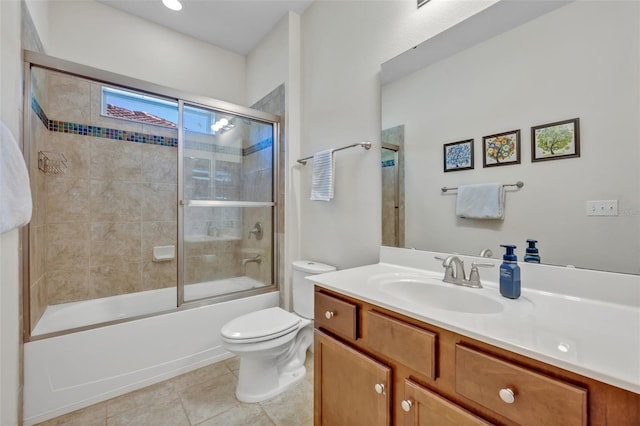 full bathroom with vanity, tile patterned floors, shower / bath combination with glass door, and toilet