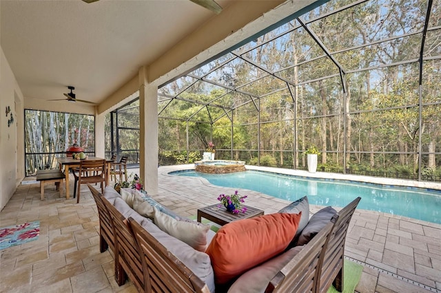 view of swimming pool featuring a lanai, ceiling fan, a patio, an outdoor living space, and an in ground hot tub