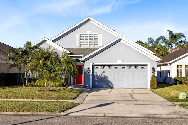 view of front facade featuring a garage and a front yard