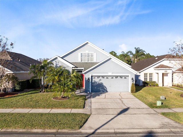 view of front of home featuring a front lawn and a garage