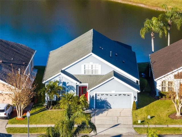 view of front of house with a water view