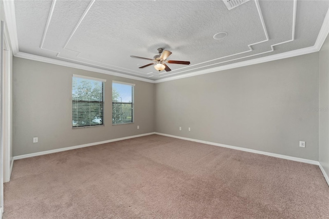 carpeted spare room with ceiling fan, crown molding, and a textured ceiling