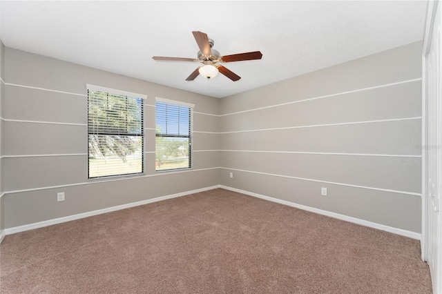 carpeted empty room with ceiling fan