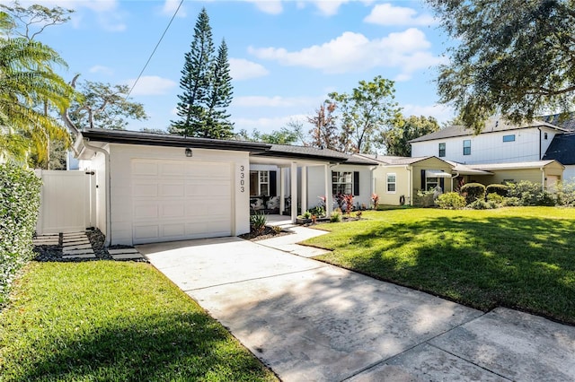 view of front of property with a garage and a front yard