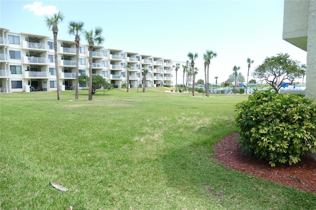 view of community featuring a yard