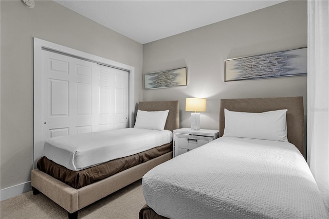 carpeted bedroom with a closet