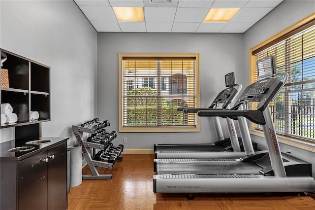 workout area with a drop ceiling