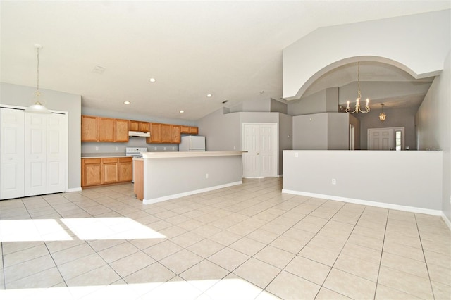 kitchen featuring pendant lighting, lofted ceiling, white appliances, an inviting chandelier, and light tile patterned floors