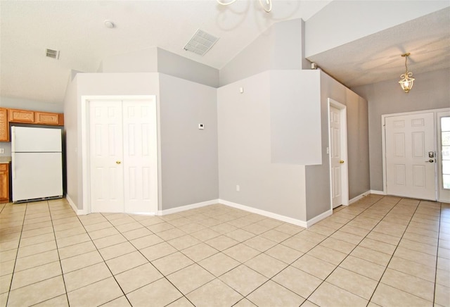 interior space featuring a chandelier and lofted ceiling