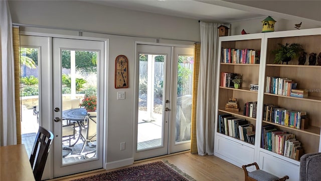 doorway featuring light hardwood / wood-style floors and french doors