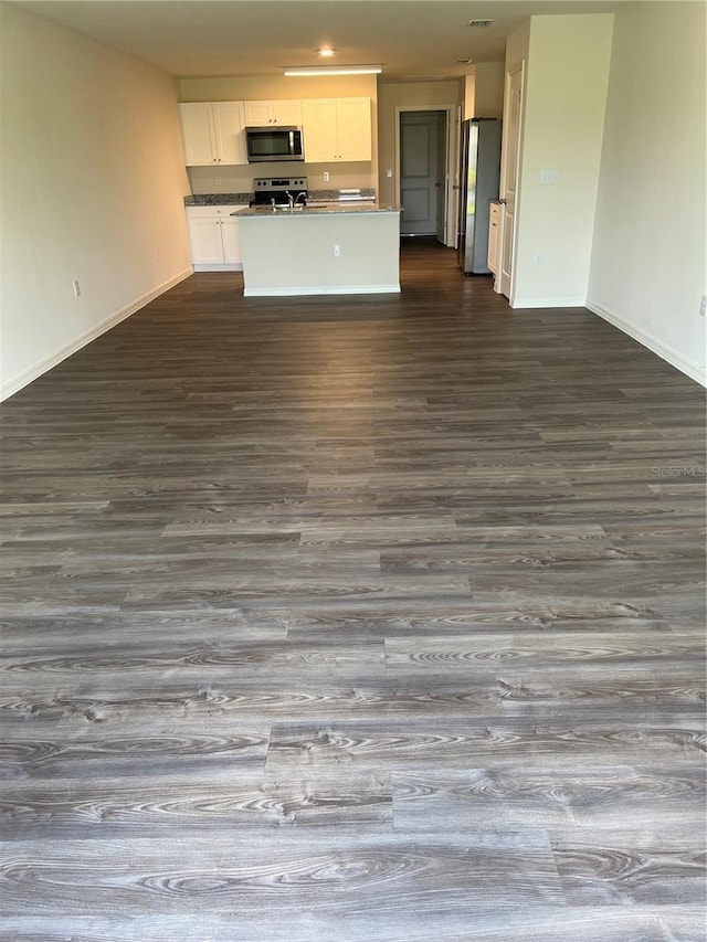 interior space with dark hardwood / wood-style flooring