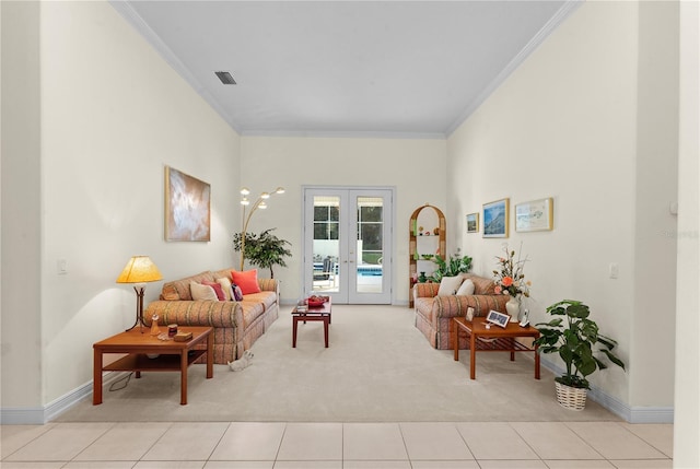 sitting room featuring light carpet, french doors, and crown molding