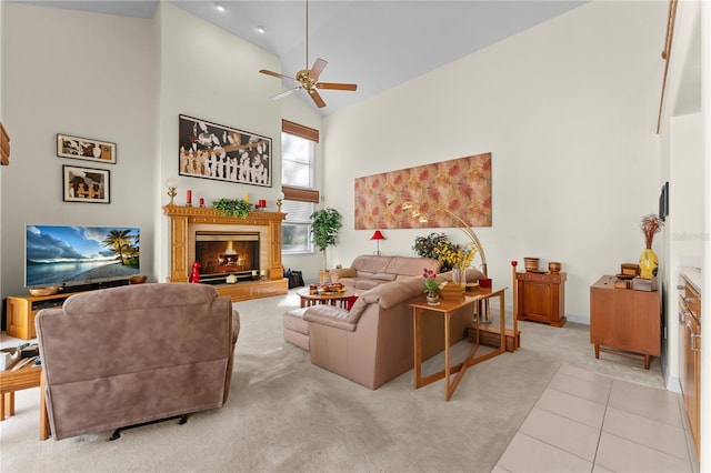 living room with ceiling fan, light tile patterned flooring, and high vaulted ceiling