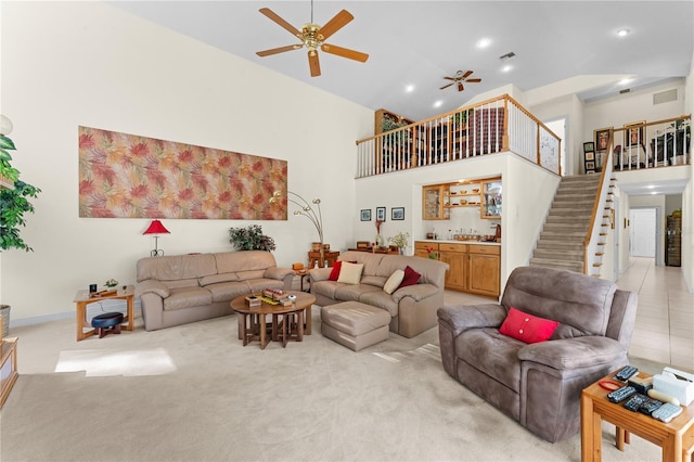 living room featuring a high ceiling and light colored carpet