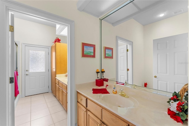 bathroom with tile patterned flooring and vanity