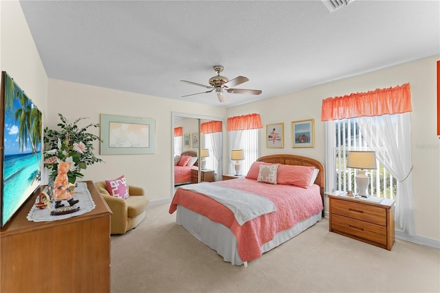 bedroom featuring ceiling fan and light colored carpet