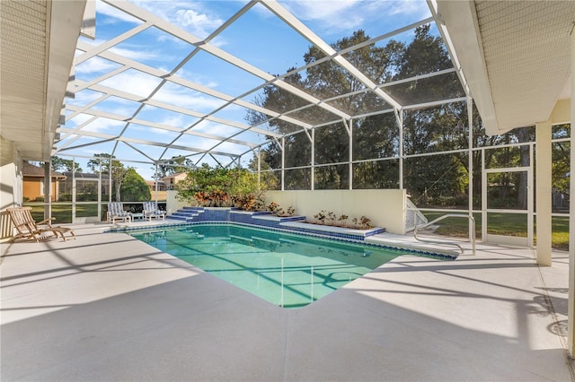 view of pool with a lanai and a patio