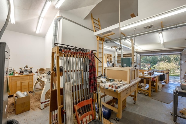 interior space featuring a workshop area and concrete flooring