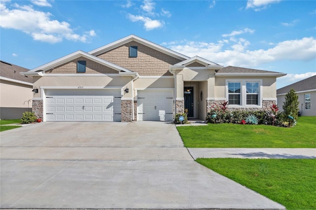 craftsman house with a garage and a front yard