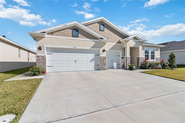 craftsman-style house with a front lawn and a garage