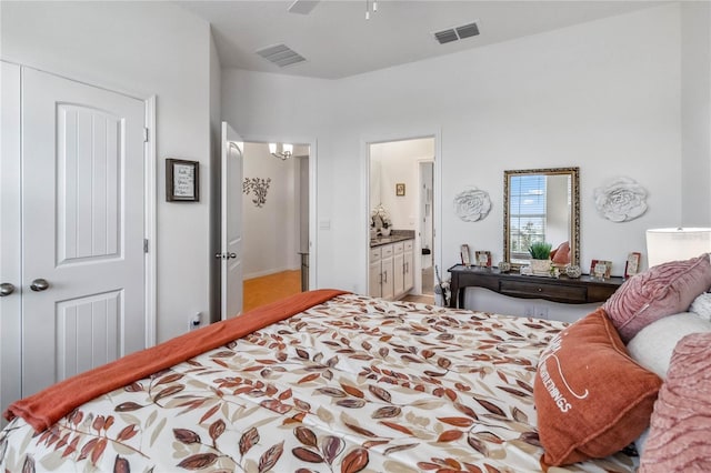 bedroom featuring connected bathroom, a closet, and ceiling fan