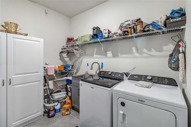 laundry area with washer and clothes dryer and sink