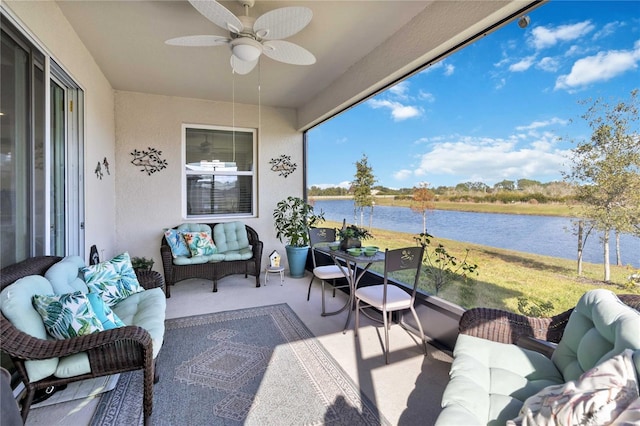 balcony featuring an outdoor hangout area, a water view, and ceiling fan