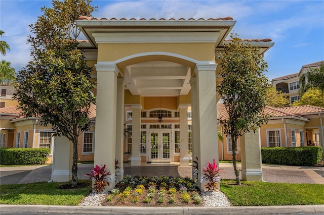 property entrance featuring french doors