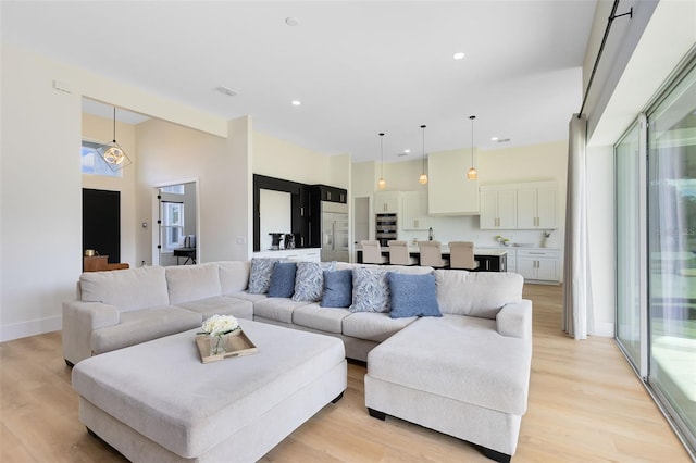 living room with light hardwood / wood-style floors