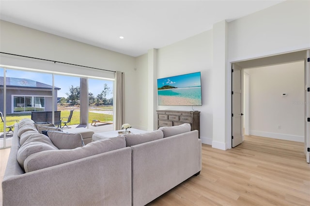 living room with light hardwood / wood-style flooring