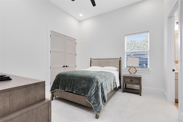 bedroom featuring ceiling fan and light colored carpet