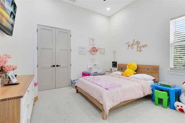 carpeted bedroom with a closet