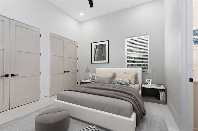 bedroom featuring ceiling fan and light carpet