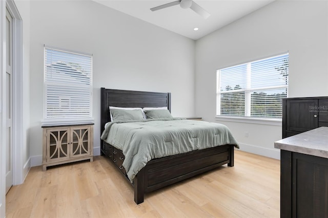 bedroom with light wood-type flooring and ceiling fan