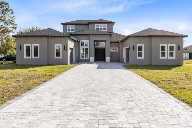 prairie-style home with a front yard