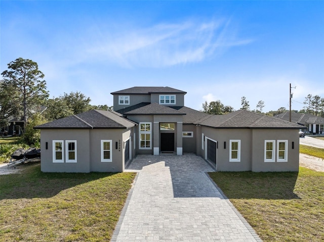 prairie-style house with a front lawn and a garage