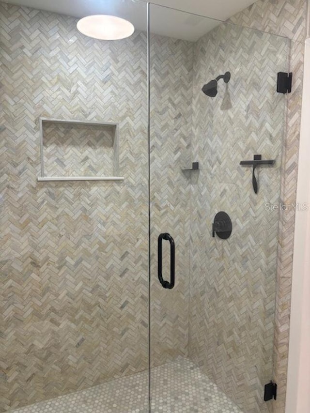 bathroom featuring an enclosed shower