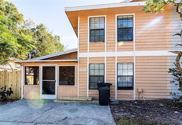 back of house featuring a sunroom