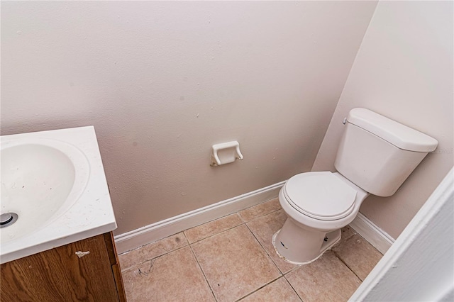 bathroom with tile patterned floors, vanity, and toilet