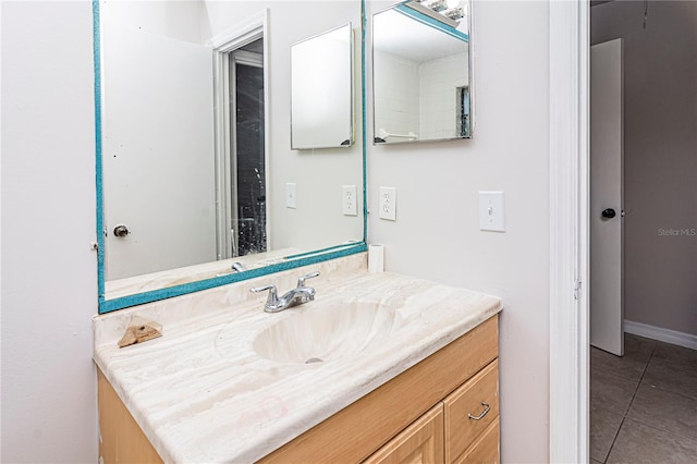 bathroom with tile patterned flooring and vanity